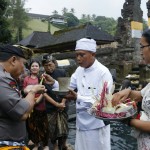 Bali Police Chief Carrying out Treatment in Tirta Empul Shower