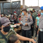 Polsek Kubu Polres Karangasem, Bagikan 500 Masker  Kepada Pengunjung Pasar.