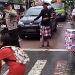 Berikan Rasa Aman dan Nyaman, Bhabinkamtibmas Dalung  Sebrangkan Anak Sekolah