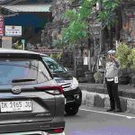 Giat Rutin Ditingkatkan, Personel Polsek Abiansemal Atur Lalu Lintas Sore Hari