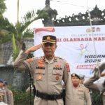 Polres Klungkung Gelar Upacara Hari Olahraga Nasional ke-42 di Tengah Hujan