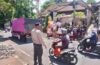 Bhabinkamtibmas Desa Paksebali Amankan Upacara Pelebon di Puri Satria Kawan.