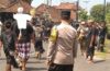 Bhabinkamtibmas Manduang Bersama Pecalang Amankan Upacara Pitra Yadnya
